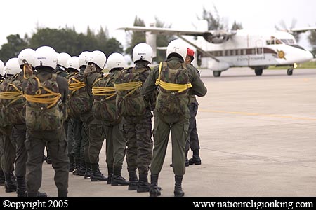 Border Patrol Police: Members of the Royal Thai Police preparing for a static line jump. Hua Hin, Thailand.