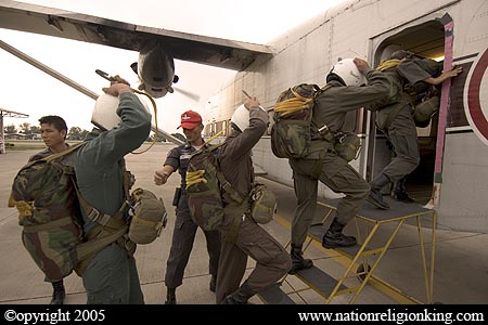 Border Patrol Police: Members of the Royal Thai Police preparing for a static line jump. Hua Hin, Thailand.