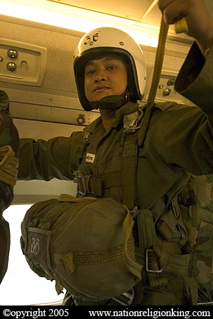 Border Patrol Police: Member of the Royal Thai Police preparing for a static line jump. Hua Hin, Thailand.